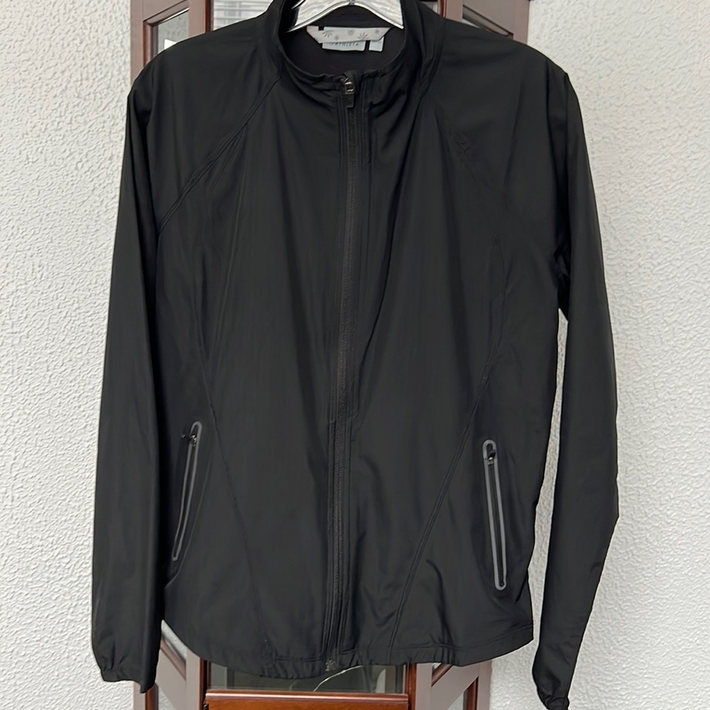 Atheleta Lightweight Running Jacket with reflective back and pockets